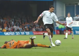 Carlos Edwards comes away with the ball