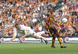 Steven Howard with a diving header