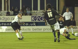 Warren Feeney shoots for goal