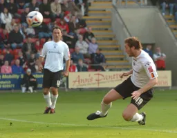 Steven Howard heads as Ahmet Brkovic looks on