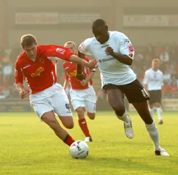 Enoch Showunmi powers past a Crewe player