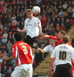 Peter Holmes wins a header