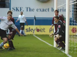 Warren Feeney prepares to strike from inside the box