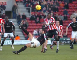Chris Coyne tries an overhead kick