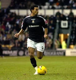 Carlos Edwards glides forward with the ball