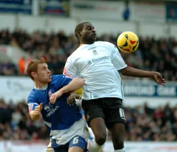 Enoch Showunmi receives the ball on his chest under pressure from an Ipswich player