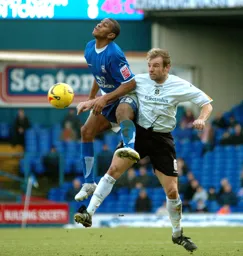 Paul Underwood and an Ipswich player challenge for the ball