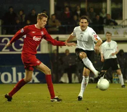 Chris Coyne watched by an admiring Peter Crouch
