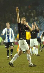 Paul Underwood salutes the fans