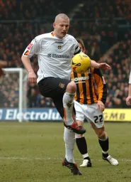 Kevin Nicholls controls the ball