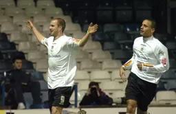 Rowan Vine arms aloft celebrates his second goal with Dean Morgan