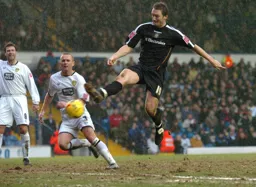 Steven Howard tries to control the ball in mid air