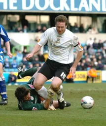 Steven Howard brought down by the Millwall goalkeeper