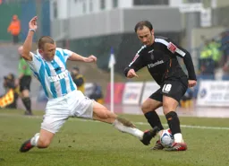 Ahmet Brkovic evades a lunging tackle