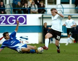 Marcus Heikkinen gets slide tackled by an Ipswich player