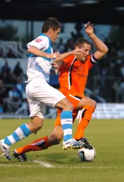 Chris Coyne is caught in possession