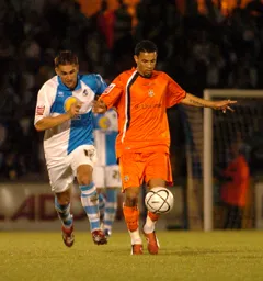 Carlos Edwards is chased down by Andy Sandell