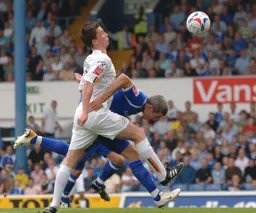 Kevin Foley sends Kevin McNaughton tumbling to the ground