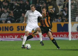 Rowan Vine shields the ball