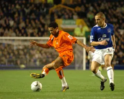 Carlos Edwards holds off Leon Osman