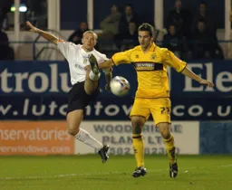 Warren Feeney and Stephen Foster in the thick of the action