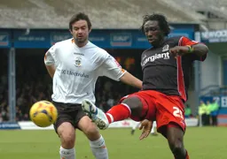 Damion Stewart knocks the ball away from Adam Boyd