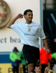 Carlos Edwards celebrates his goal