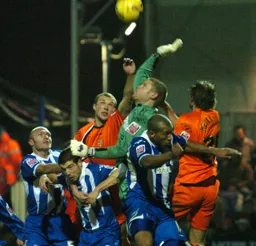 Warren Feeney puts Dean Gerken under pressure