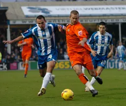 Rowan Vine gets past Richard Garcia