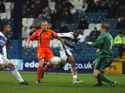 Former Town loanee Simon Royce saves from Warren Feeney