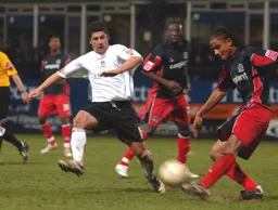 Steve Robinson moves in to block a clearance