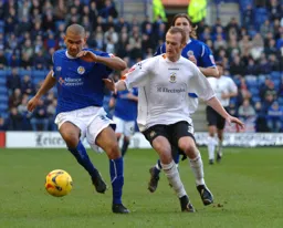 Patrick Kisnorbo holds off Drew Talbot