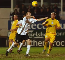 Drew Talbot waits for the ball to drop before slamming it into the net for the third goal