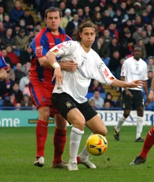 Despite being held Bjorn Runstrom bring the ball under control