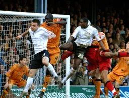 Leon Barnett heads in Town`s second goal