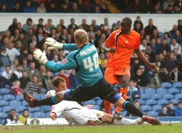 Casper Ankergren saves this effort by Leon Barnett