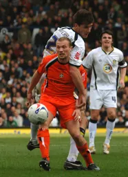 Warren Feeney holds the ball up