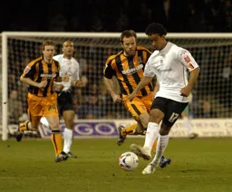 Richard Langley passes the ball forward