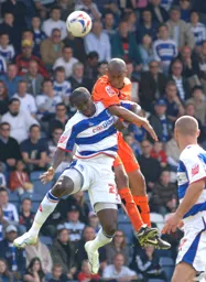 Calvin Andrew rises above Damion Stewart to win a header