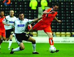 David Bell shows a clean pair of heels to Marc Edworthy