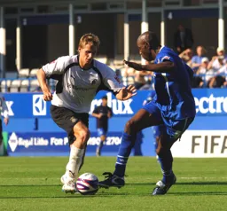 Dave Edwards takes on the Gillingham player
