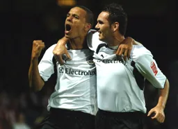 Dean Morgan celebrates with goalscorer David Bell