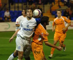 Chris Coyne in a battle for the ball