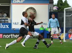 Dean Morgan attempts to get to the ball