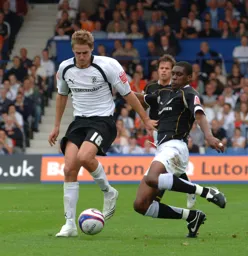 Dave Edwards is about to be tackled