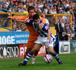 Darren Currie battles for the ball