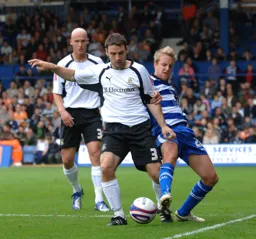 Alan Goodall looks to play the ball down the line