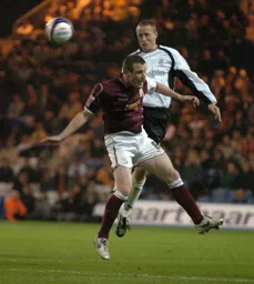 Chris Perry heads clear