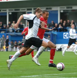 Dave Edwards takes on the Forest player