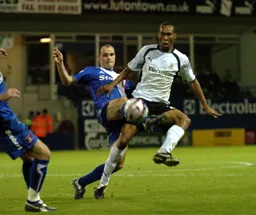 Calvin Andrew being challenged for the ball
